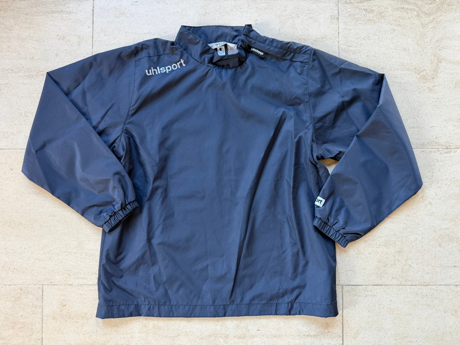 Regenjas Uhlsport maat 152, Ophalen of Verzenden, Nieuw, Jongen, Jas