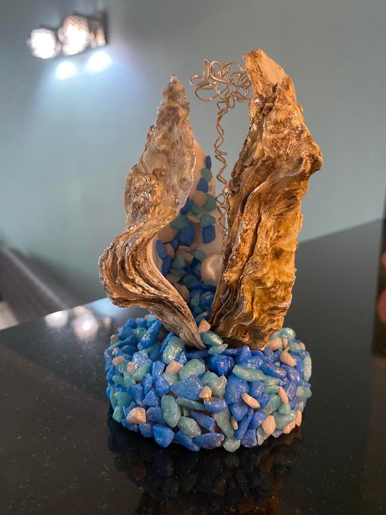 Foto- en ringhouder gemaakt van natuurlijke schelpen, Ophalen