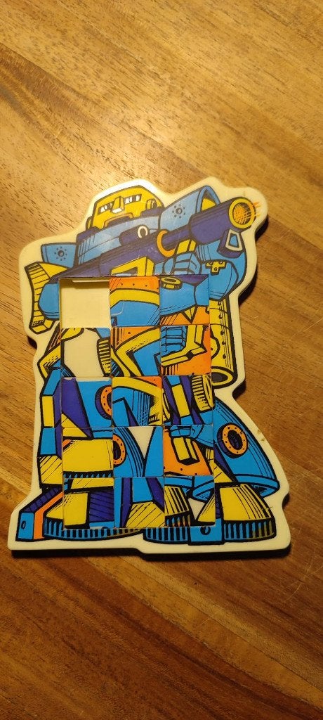 Vintage schuifpuzzel in de vorm van een gevechtsrobot., Ophalen of Verzenden
