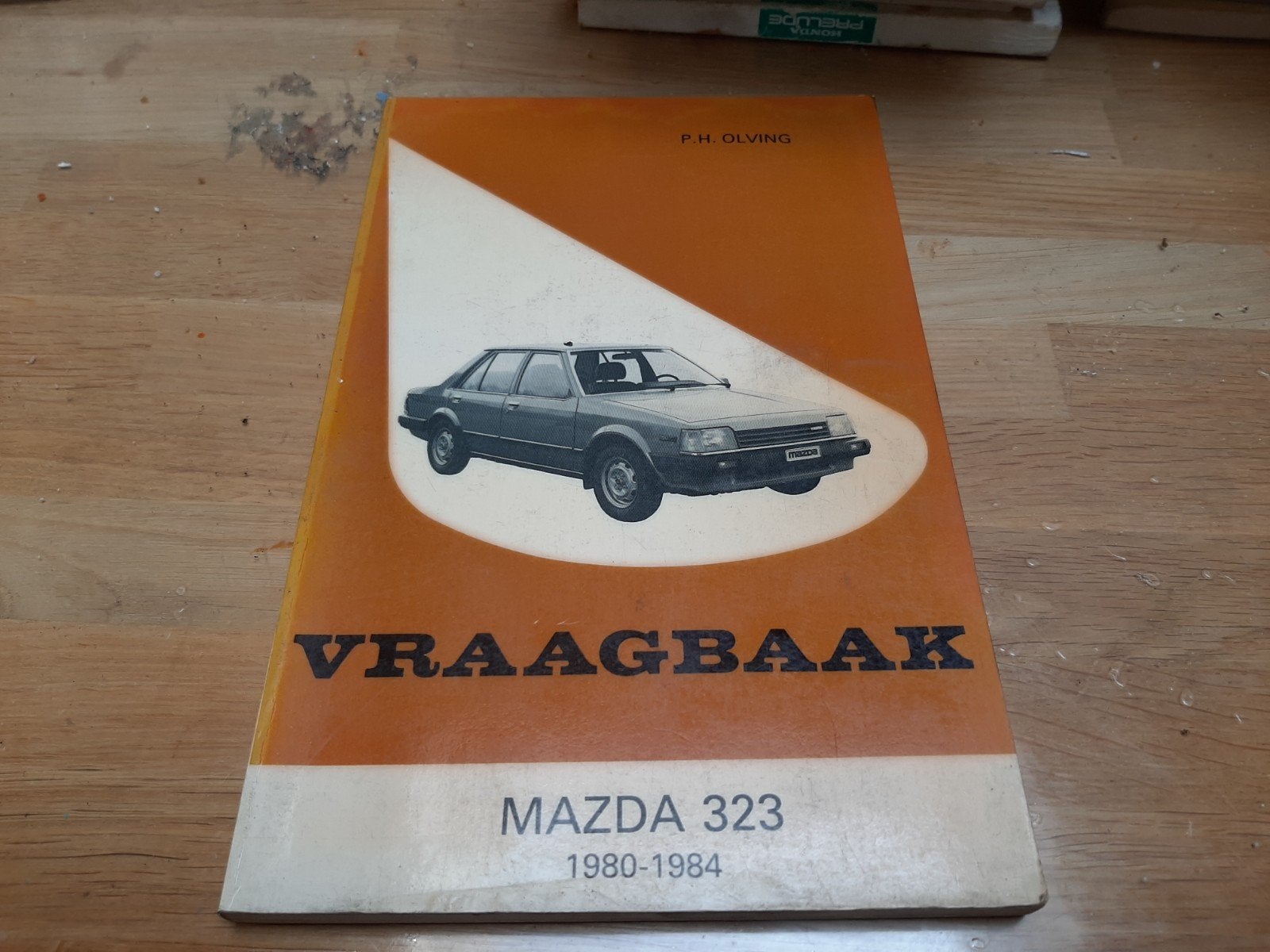 Vraagbaak Mazda 323 (1980-1984) - F.H. Olving, Ophalen of Verzenden