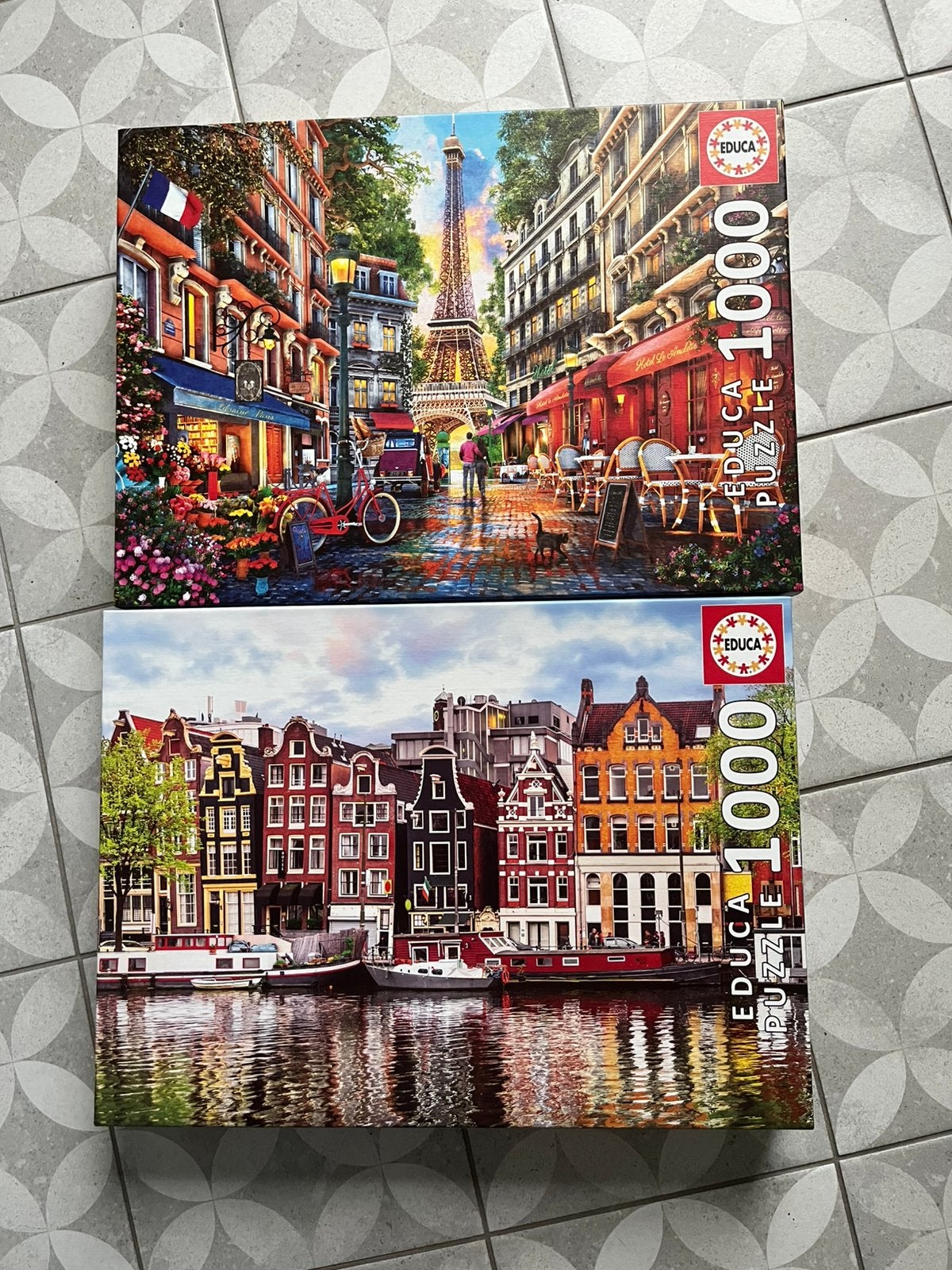 Set van 2 puzzels Educa - Amsterdam en Parijs - 1000 stuks, Enlèvement ou Envoi, Comme neuf
