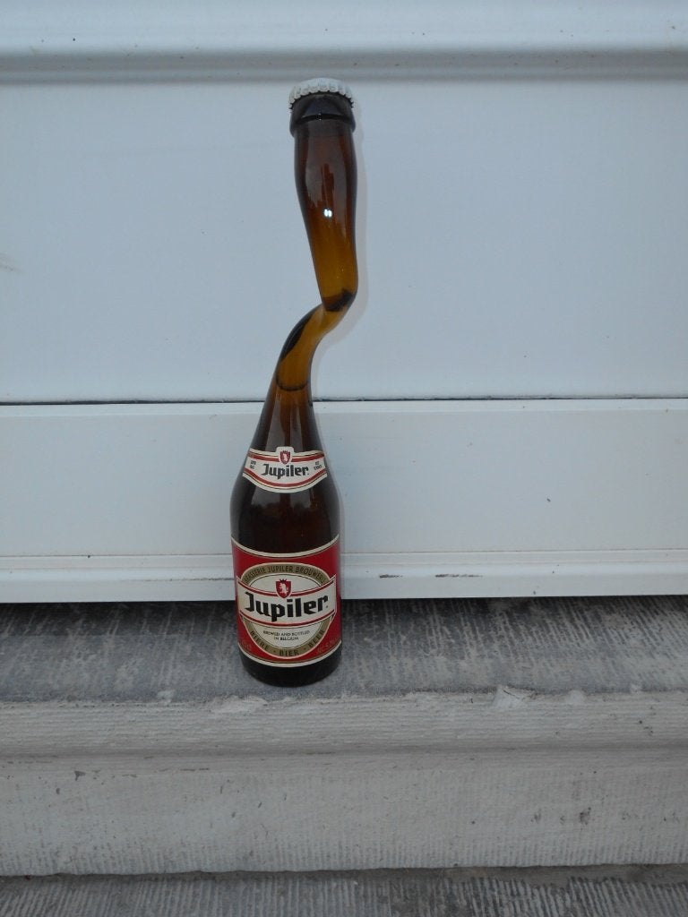 Jupiler: uitgerekte fles met gedraaide hals, jaartal(vintage, Verzamelen, Biermerken, Zo goed als nieuw, Flesje(s), Jupiler, Ophalen of Verzenden