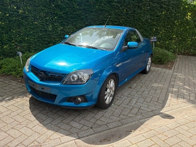 Opel Tigra van 2004 met 45000km., Autos, Opel, Particulier, Tigra, Essence, Cabriolet, 2 portes, Boîte manuelle, Bleu, Noir, Tissu