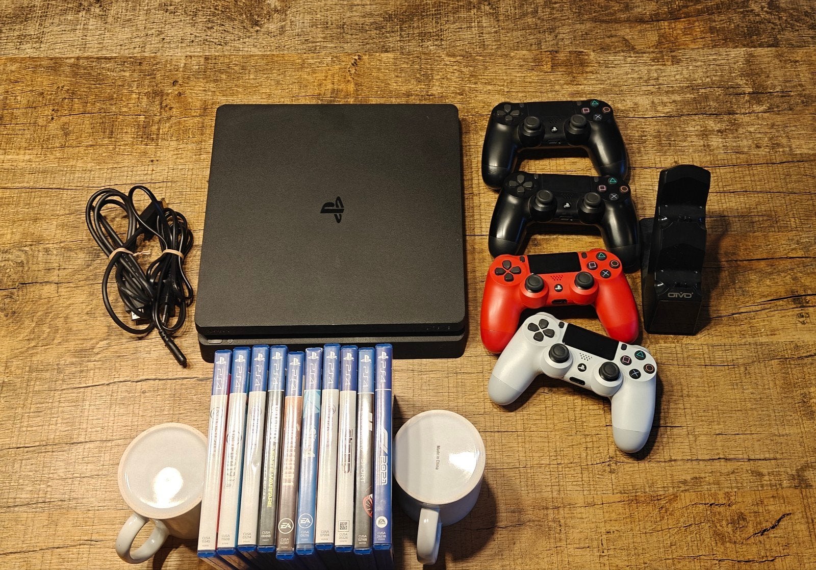 PlayStation 4 met 4 controllers, oplaadstation en 10 games, Ophalen of Verzenden, Met 3 controllers of meer, Slim, 500 GB