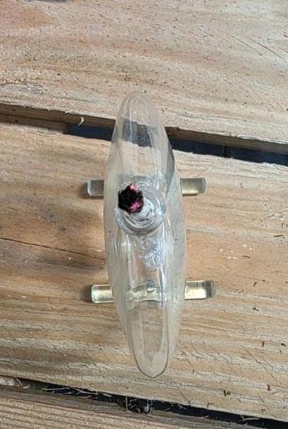Antieke glazen babyfles, Ophalen