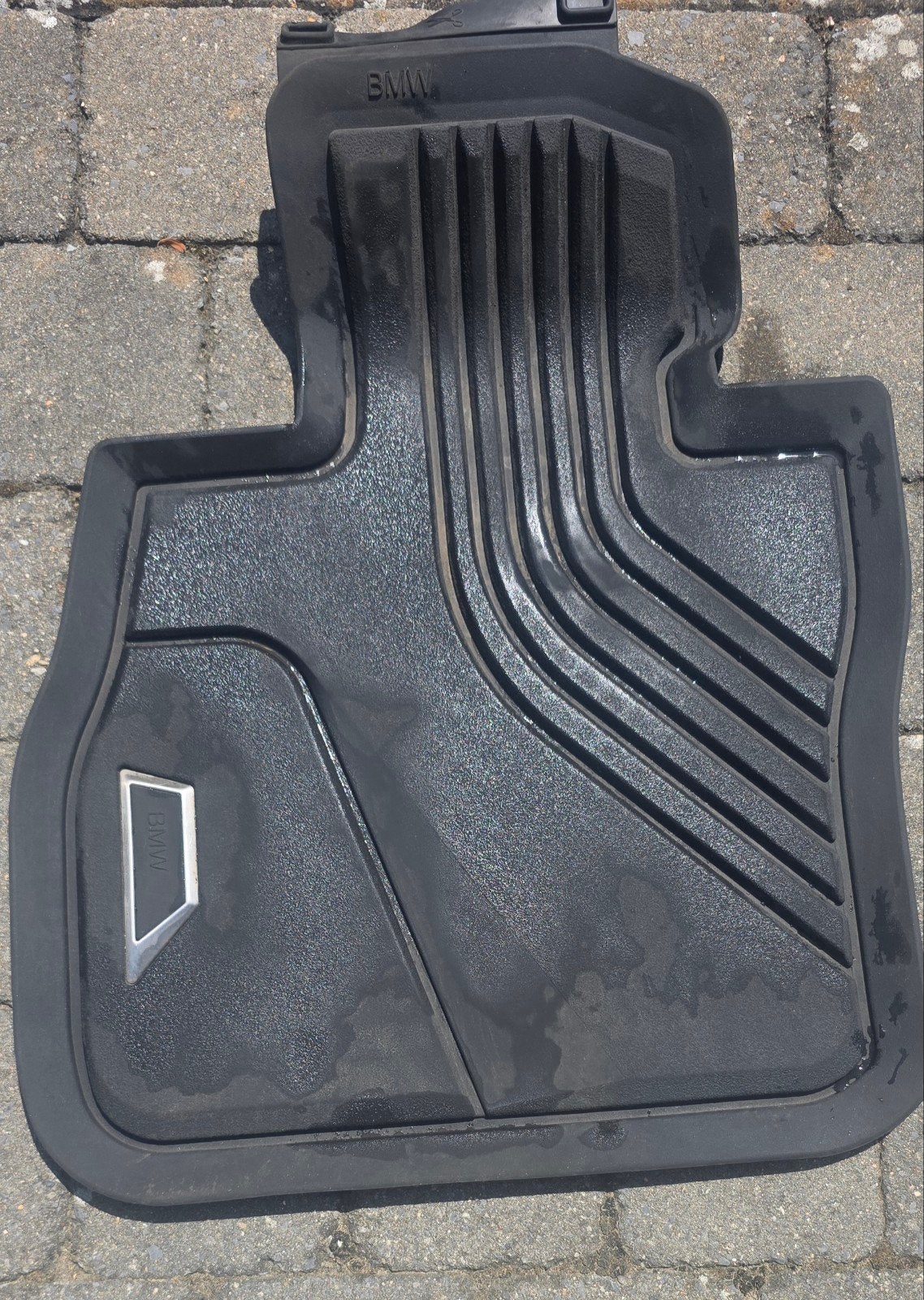 Rubber matten BMW, Ophalen