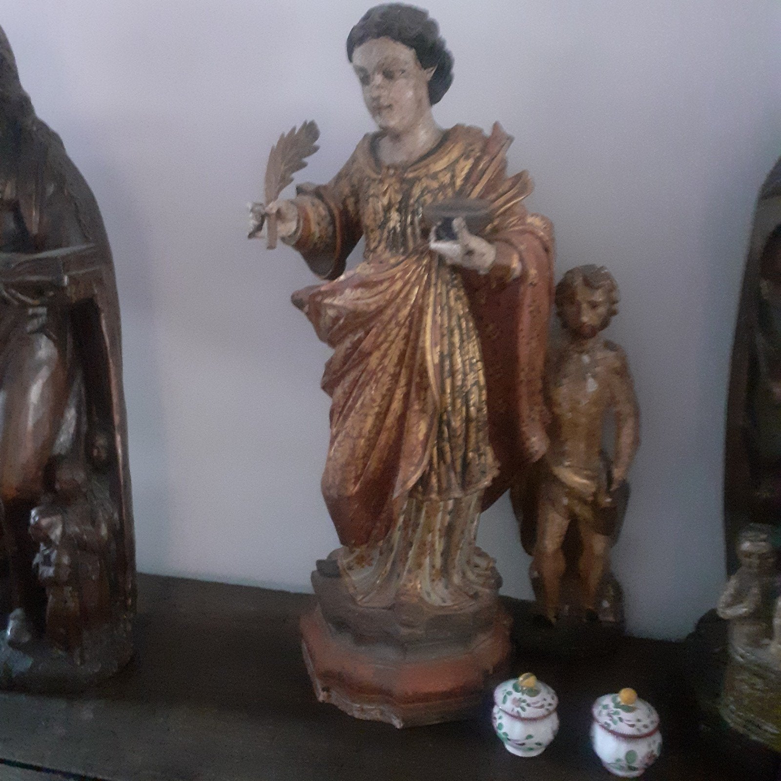 antieke houten beeld, Ophalen