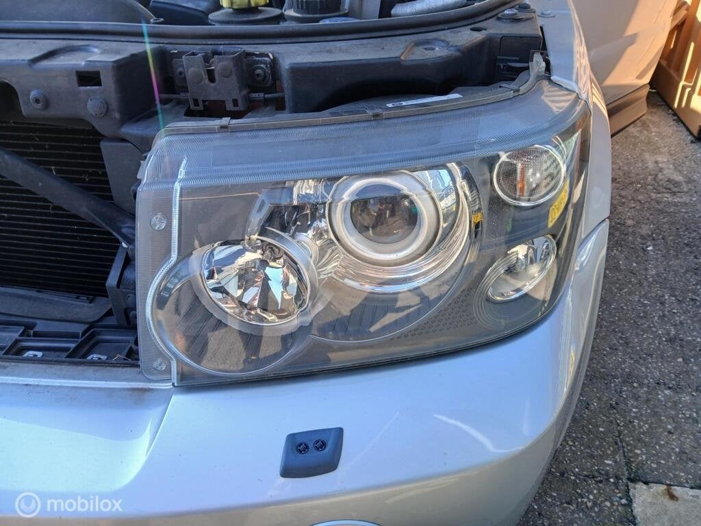 Koplamp Range Rover Sport L320 AFS bochtenverlichting, Land Rover, Ophalen of Verzenden, Gebruikt, Land Rover