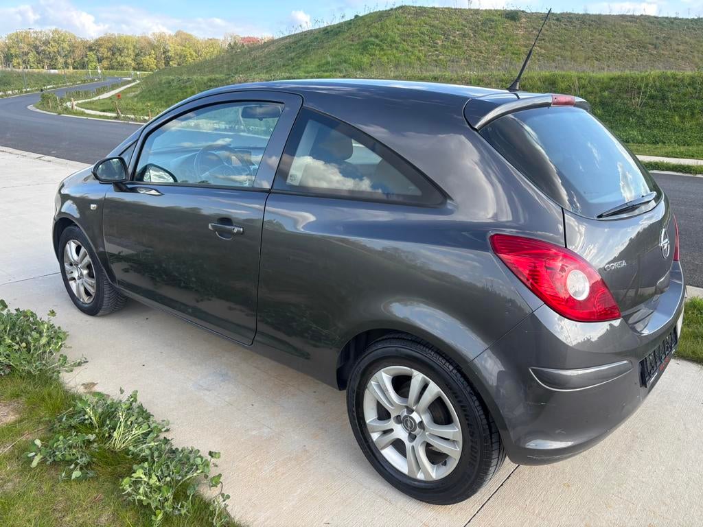 Opel Corsa 1.2i Essence année 2013 Euro 5 avec airco, Auto's, Stof, Zwart, 4 cilinders, Bedrijf