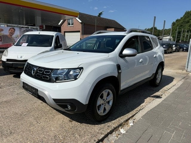 Dacia Duster Benzine Airco Navi Camera PDC Cruise ALU!, Auto's, Dacia, Stof, Euro 6, 4 cilinders, Duster