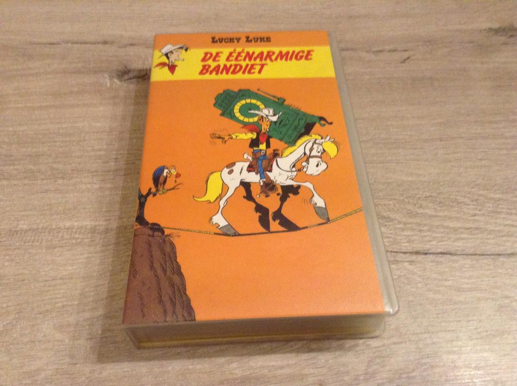 Film VHS de Lucky Luke : Le bandit manchot (1995) (Nouveau), Collections, Personnages de BD, Enlèvement ou Envoi, Super héros