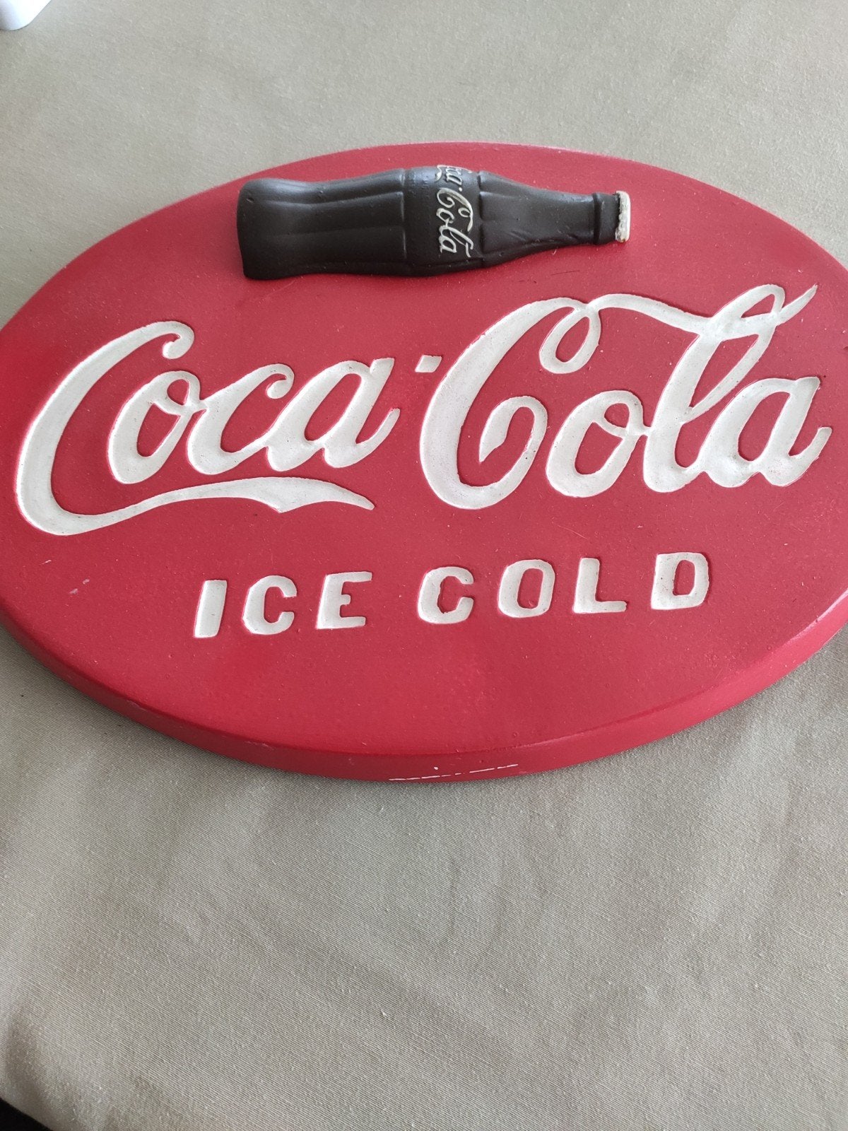 Coca Cola bord ovaal, Enlèvement, Panneau publicitaire