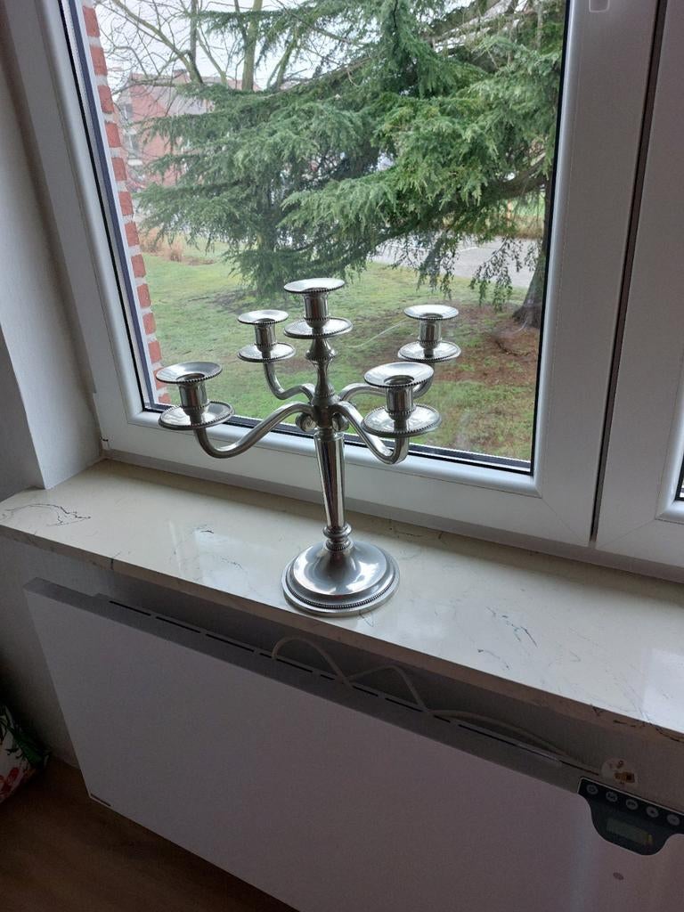 Tinnen kandelaar, Ophalen