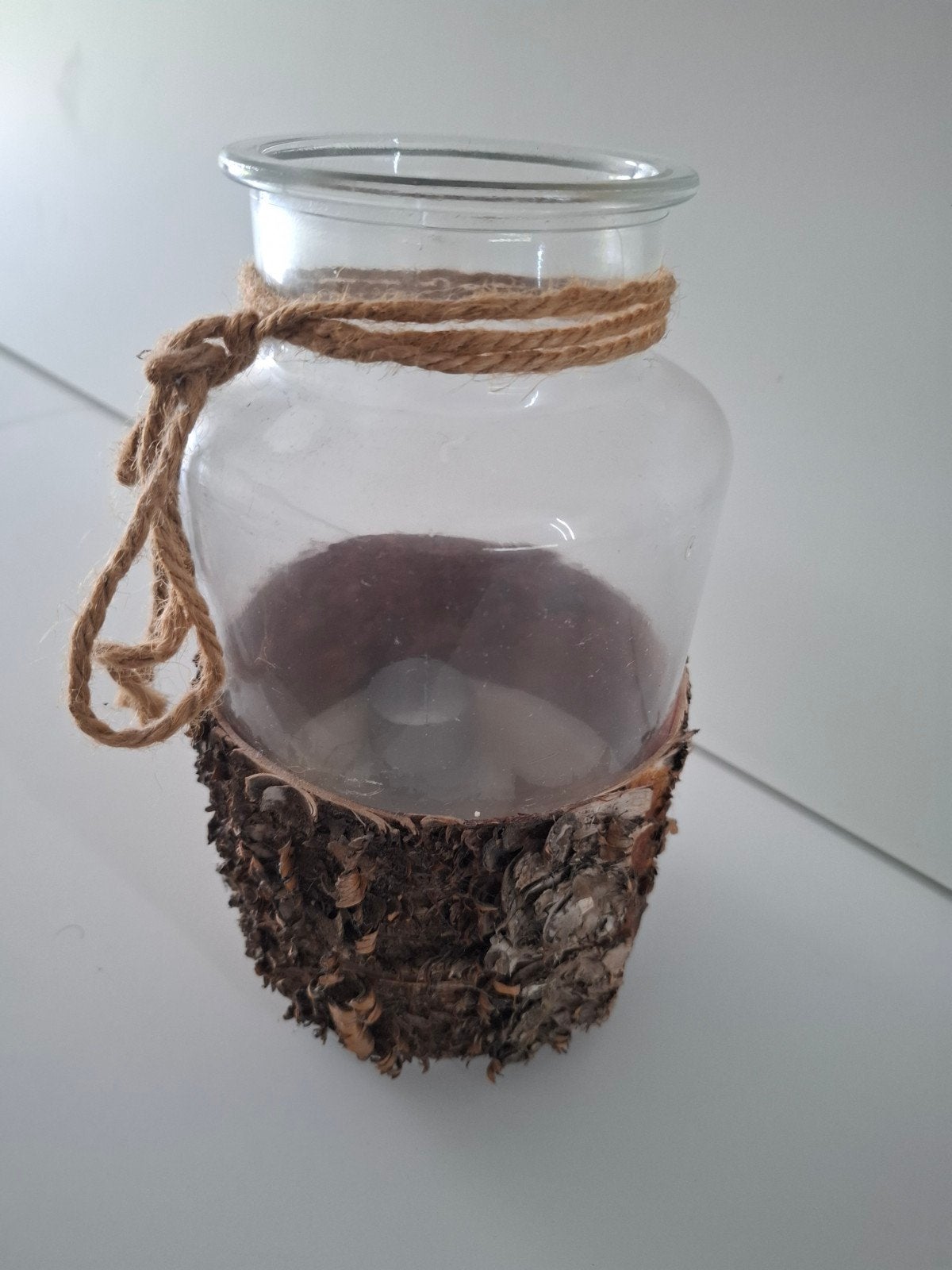 theelicht houder, Ophalen