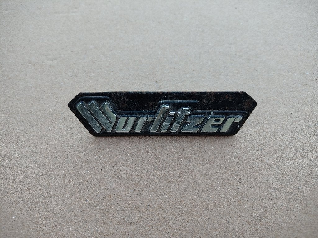 Embleem Wurlitzer (Div) jukebox, Envoi, Wurlitzer