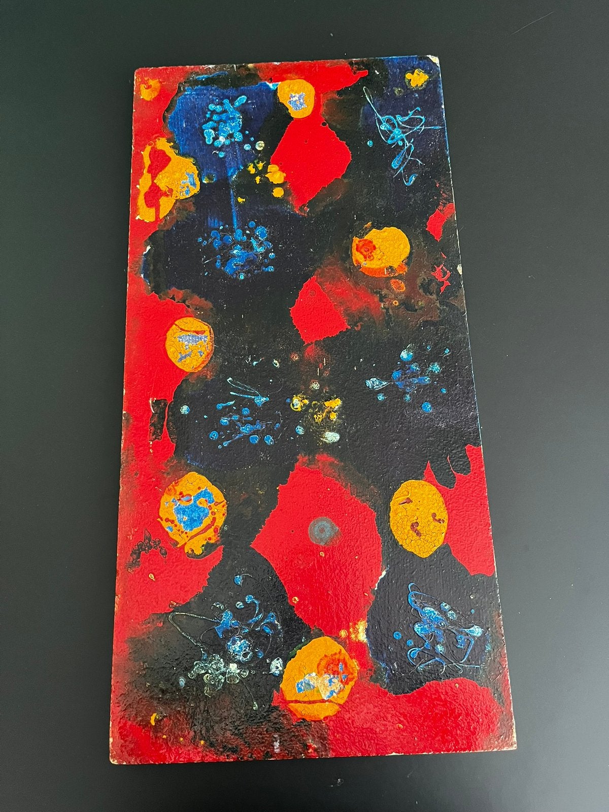 Abstract schilderij op hout, Ophalen