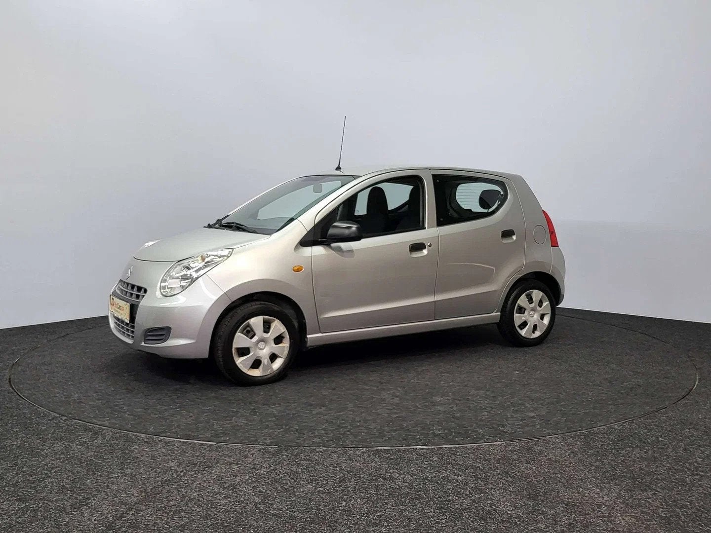 Suzuki Alto 1.0i | 2010 | 102.924 km | Airco | Radio | 1ste, Auto's, Stof, Zwart, Elektrische ramen, 996 cc