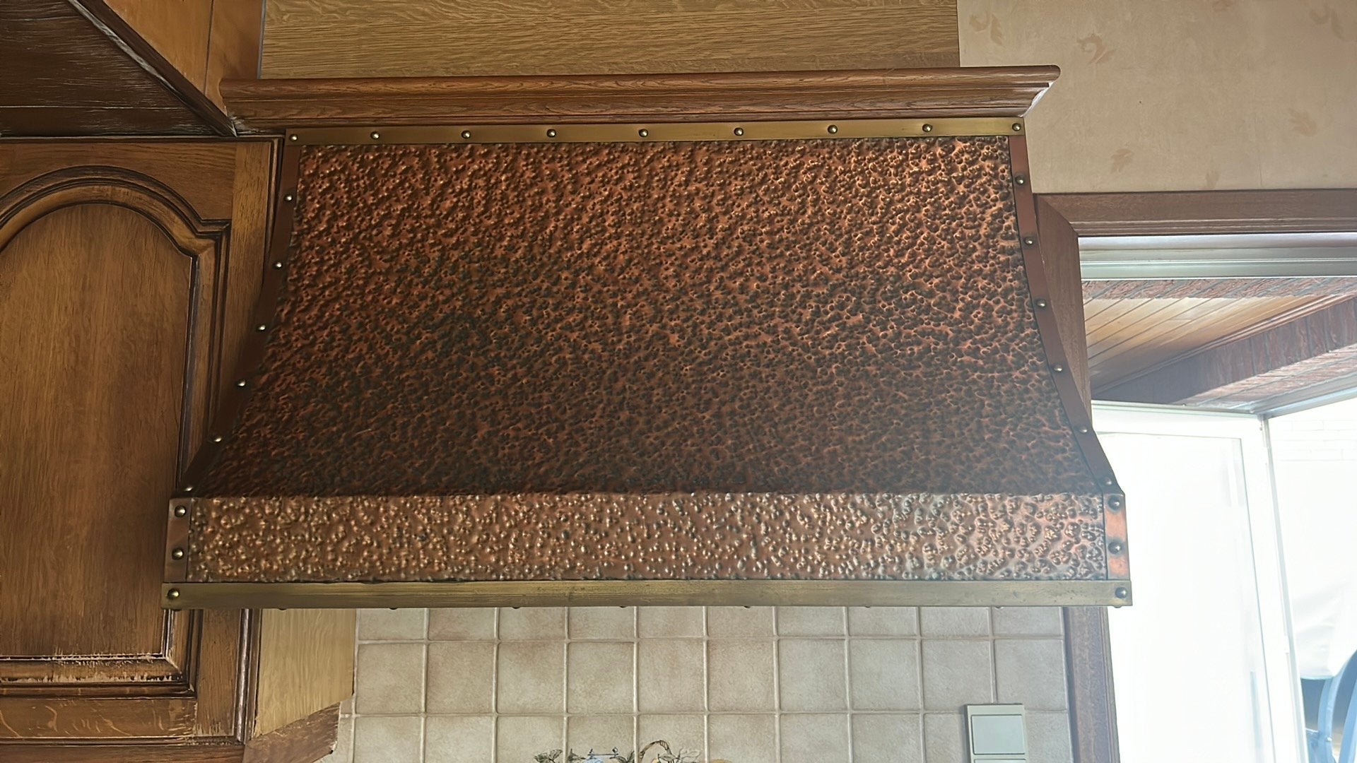 Koperbekleedde dampkap NOVY, Ophalen