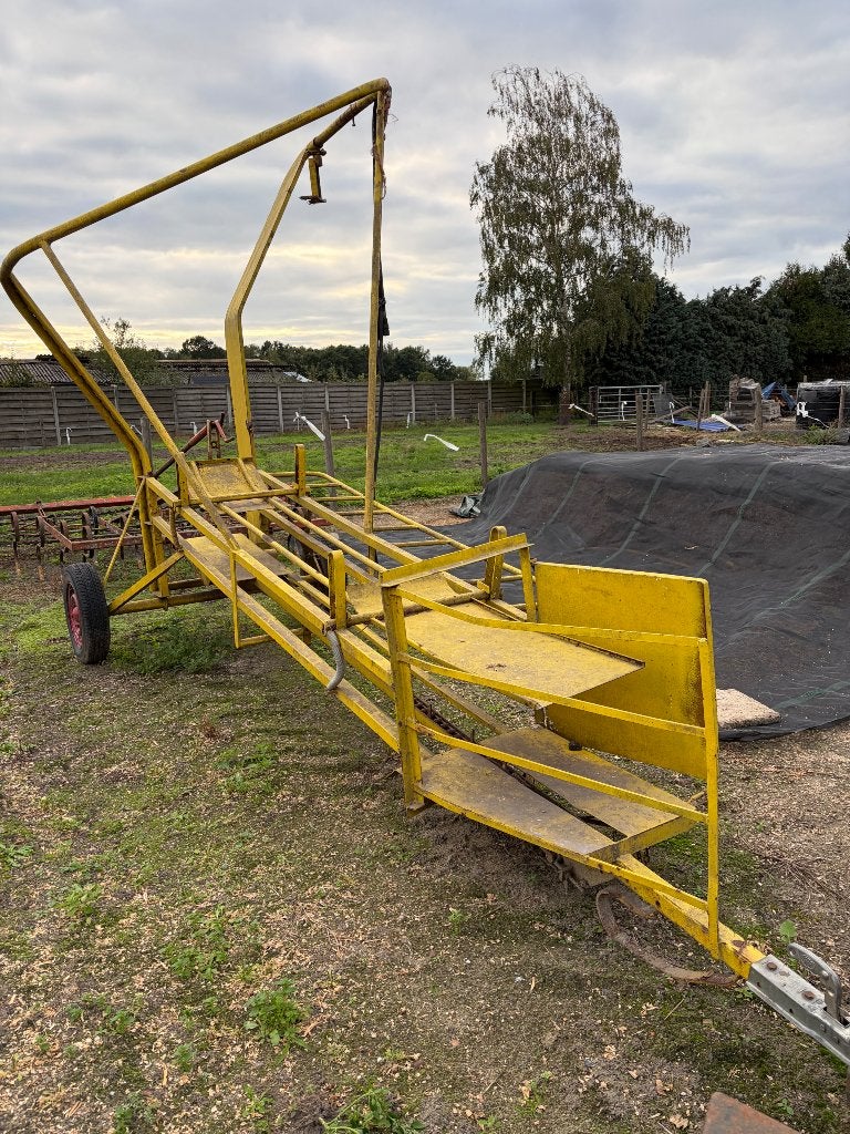 Hydraulische stro-hooi pakken lader, Enlèvement