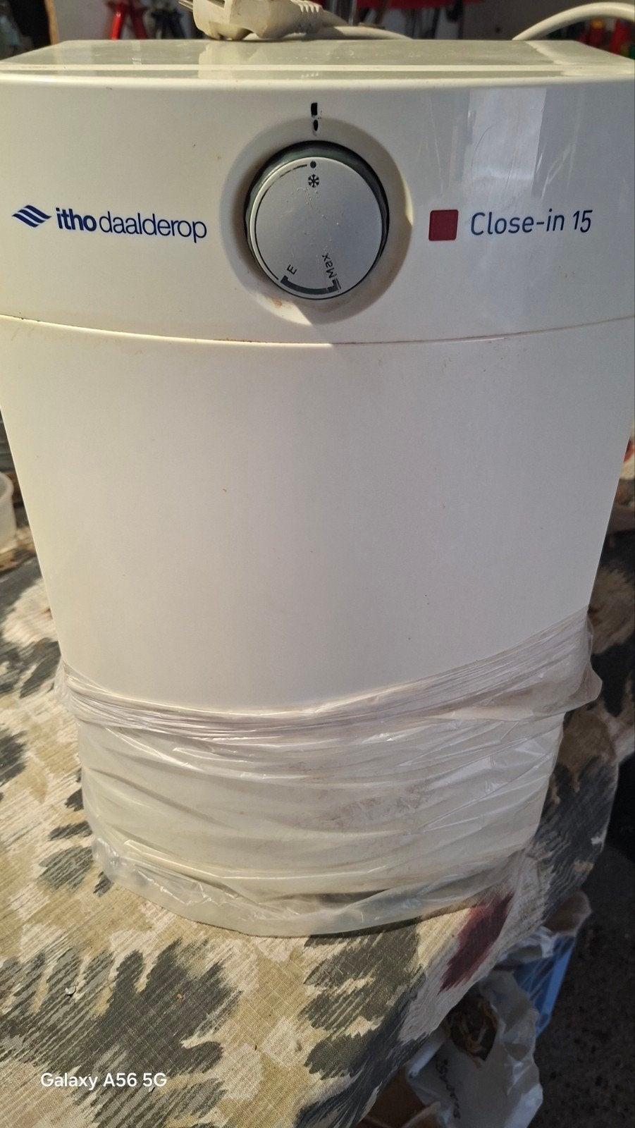 Waterverwarmer van 15 liter, Ophalen