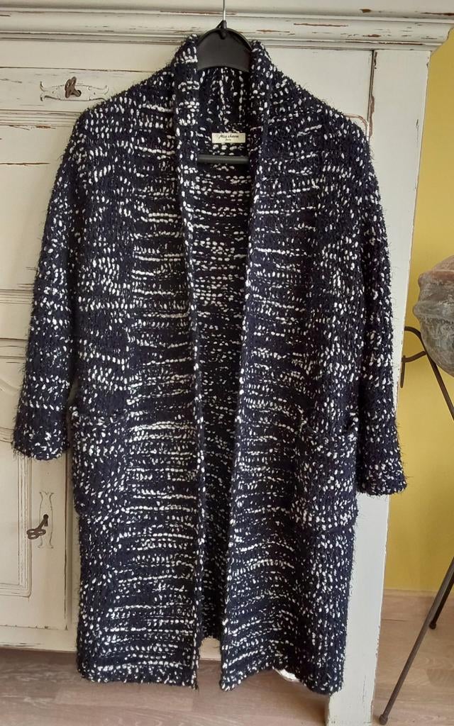Warme soepel vallende vest, Ophalen