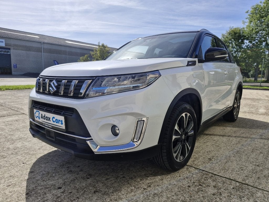 Suzuki Vitara 1.4 Benzine 2022 / 1 Jaar Garantie, Auto's, Voorwielaandrijving, Stof, 4 cilinders, Wit