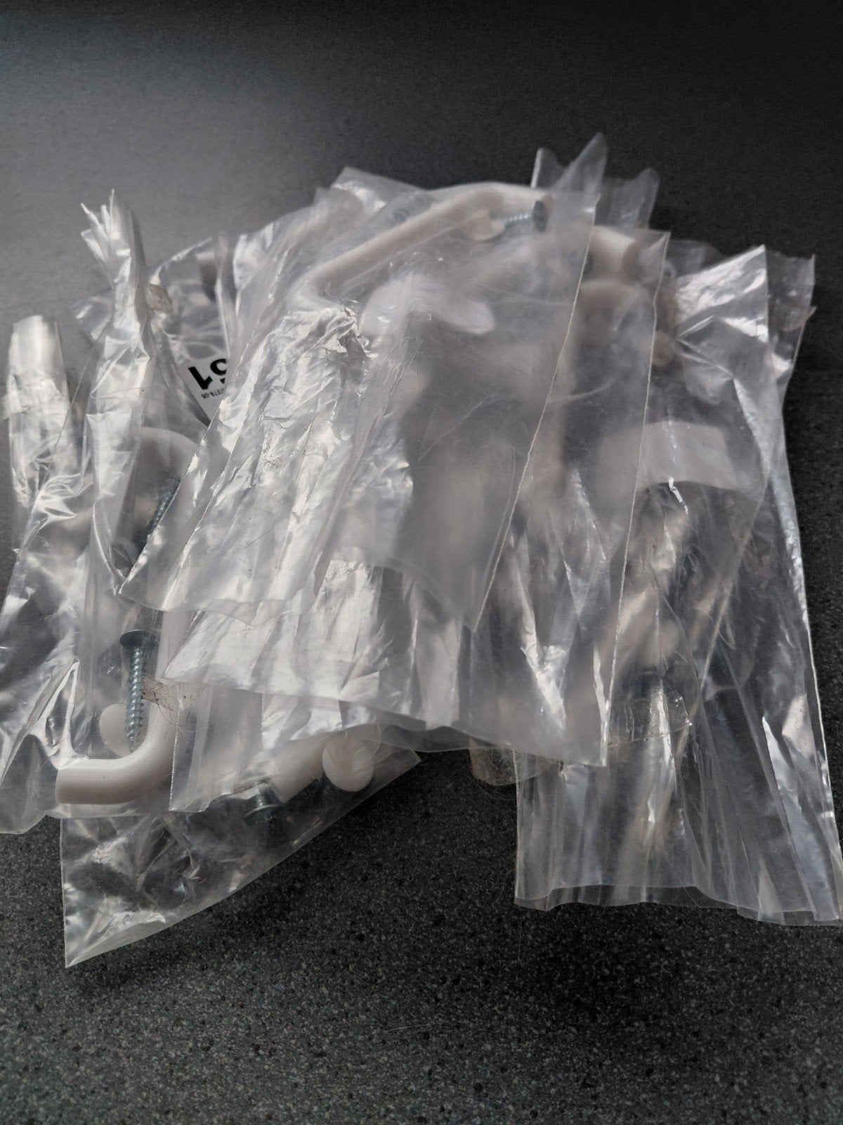 10 witte handvatten, Enlèvement