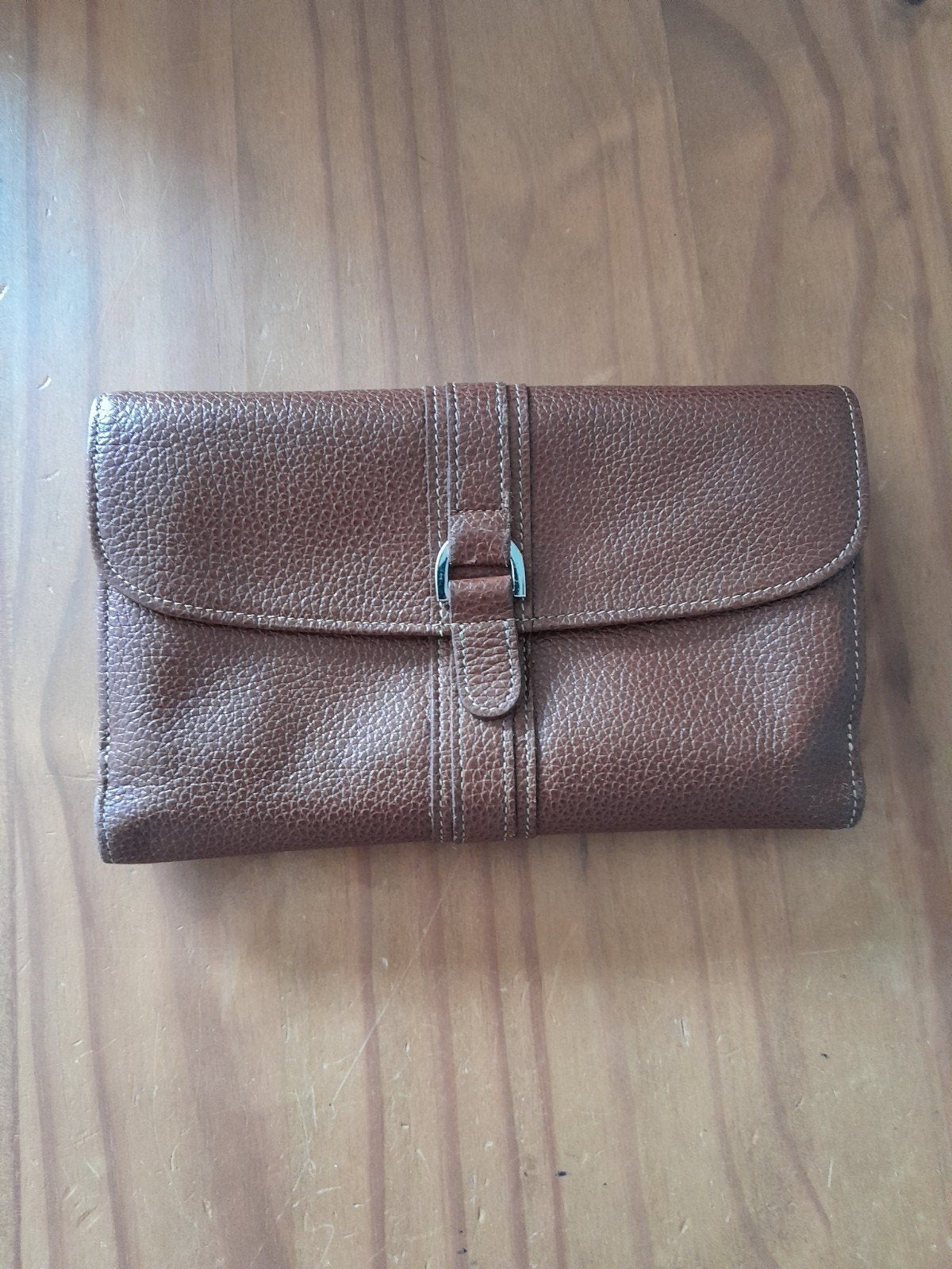 Longchamp portefeuille, Ophalen