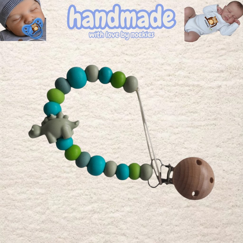 Pince à tétine Noekies Dino Turquoise Kaki N 27, Enlèvement ou Envoi, Neuf, Cadeau d'accouchement