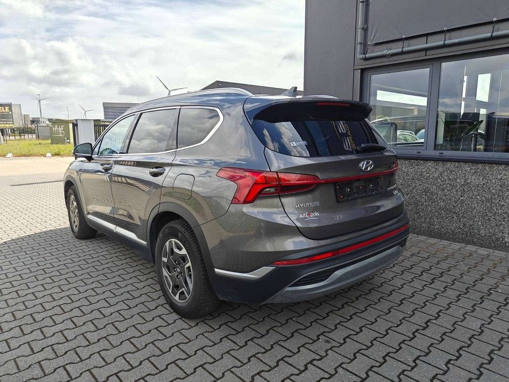 Hyundai Santa Fe 1.6 HEV T-GDi 180pk 7-zit/MemoryLeder/AdCru, Autos, Hyundai, Argent ou Gris, Entreprise, 7 places, 179 ch