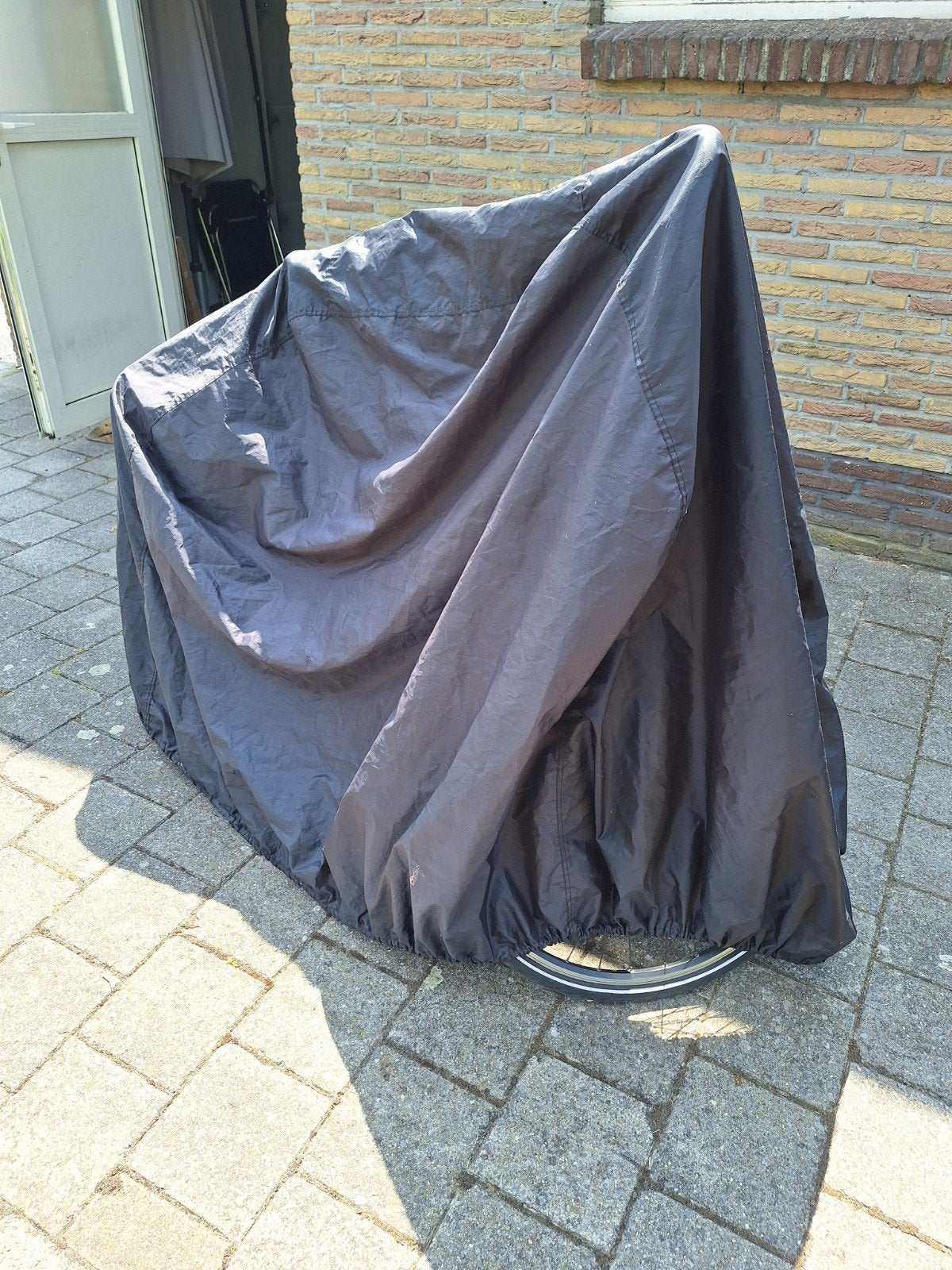 beschermhoes fietsen, Ophalen