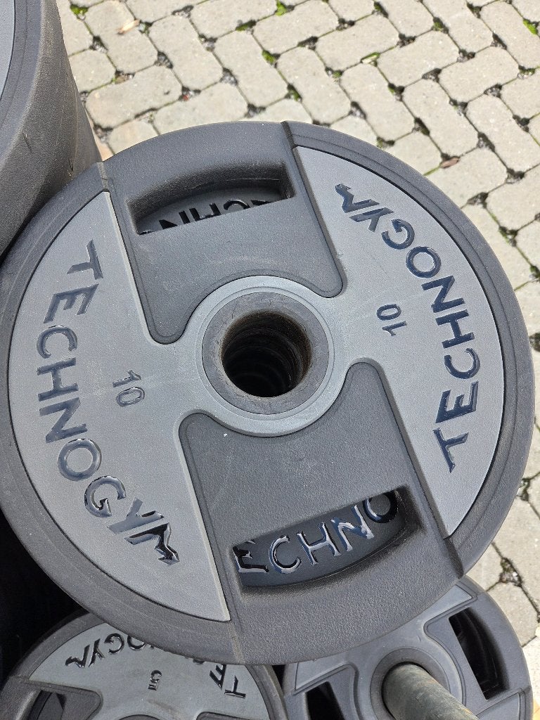 Technogym PU Urethane halterschijven - diverse gewichten, Ophalen, Zo goed als nieuw, Benen, Halterschijven