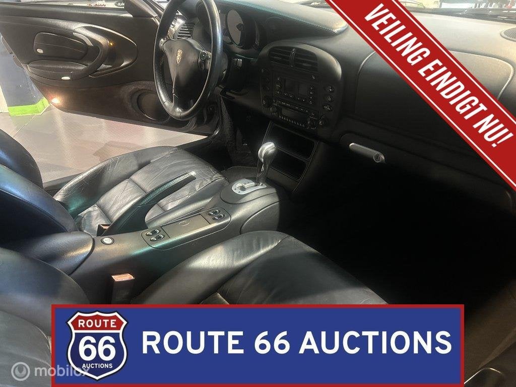 Porsche 911 Carrera 4 Cabriolet | Route 66 Auctions, Auto's, Gebruikt, Zwart, Bedrijf, Handgeschakeld