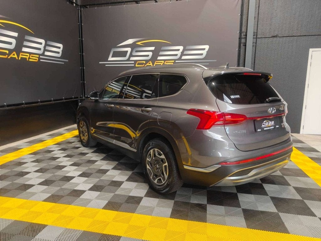 Hyundai Santa Fe 1.6 HEV T-GDi 180pk 7-zit/MemoryLeder/AdCru, Auto's, Hyundai, Santa Fe, Zwart, 4 cilinders, Sound system