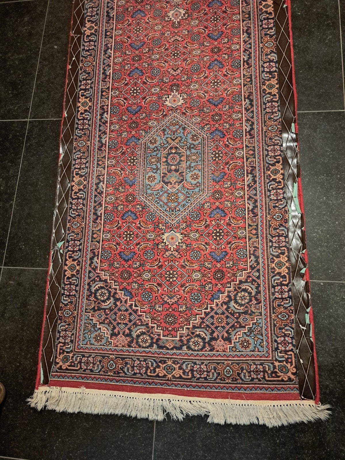 Indisch handgeknoopt tapijt, Ophalen