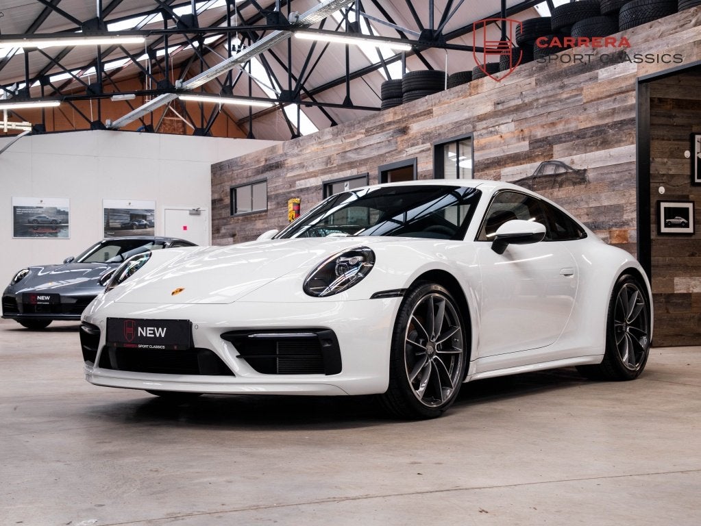 Porsche 911 992 Carrera Coupé 3.0 Carrera / Sport design /, Auto's, Porsche, Automaat, 4 zetels, Gebruikt, Zwart