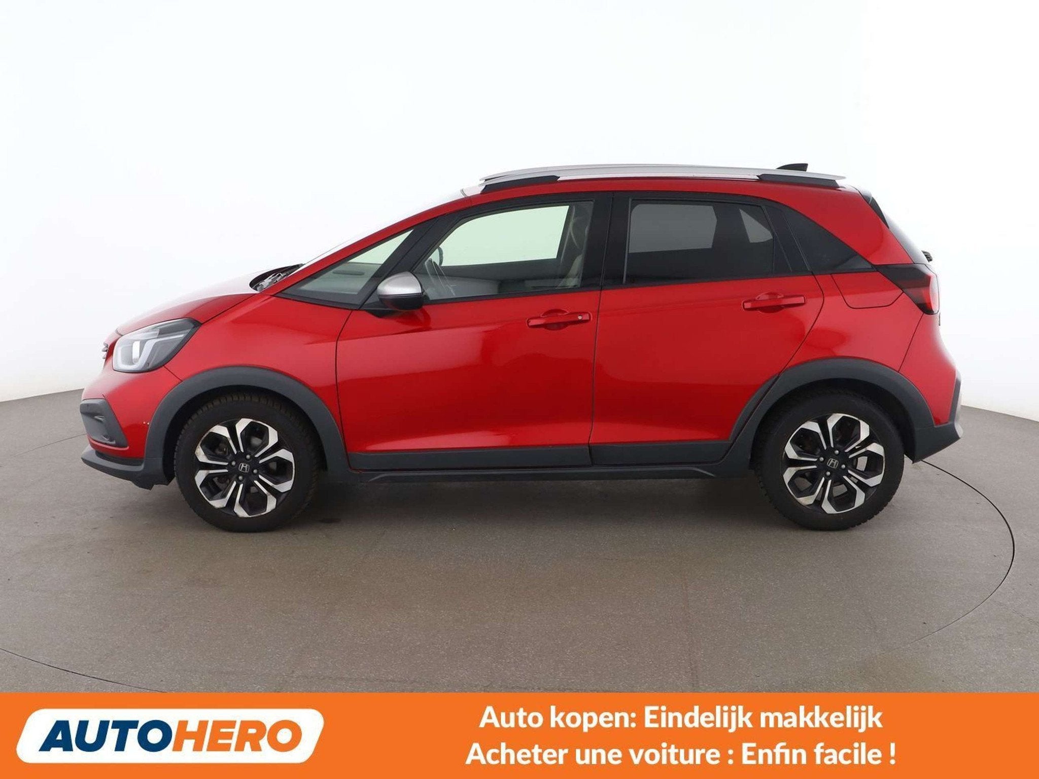 Honda Jazz 1.5 i-MMD Hybrid Crosstar Executive, Autos, Rouge, Euro 6, Détection des panneaux routiers, 109 g/km