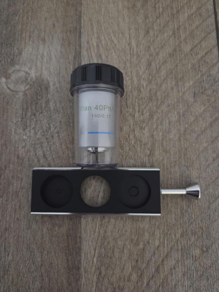 Objectif Motic Plan Phase PL Ph 40x 0,65 + Coulisseau, Enlèvement ou Envoi, Comme neuf, 400x à 1000x, Pièces ou Accessoires