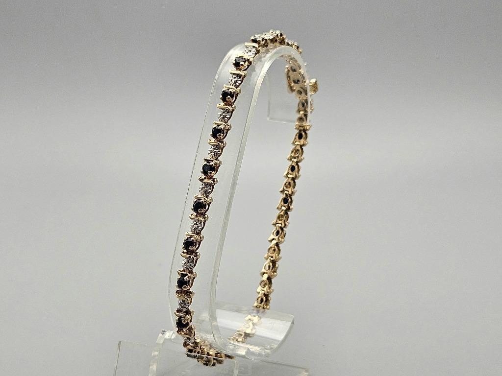 Gouden Vintage tennisarmband met saffier en diamant. 2024/58, Blauw, Ophalen of Verzenden, Zo goed als nieuw, Met edelsteen