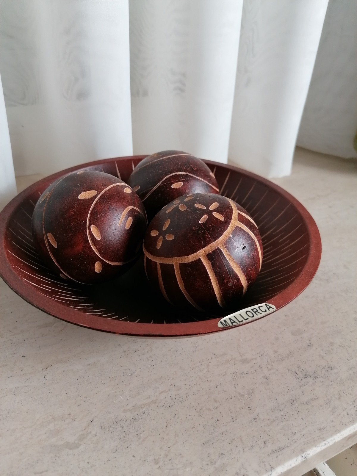 Houten bollen in schaaltje, Ophalen
