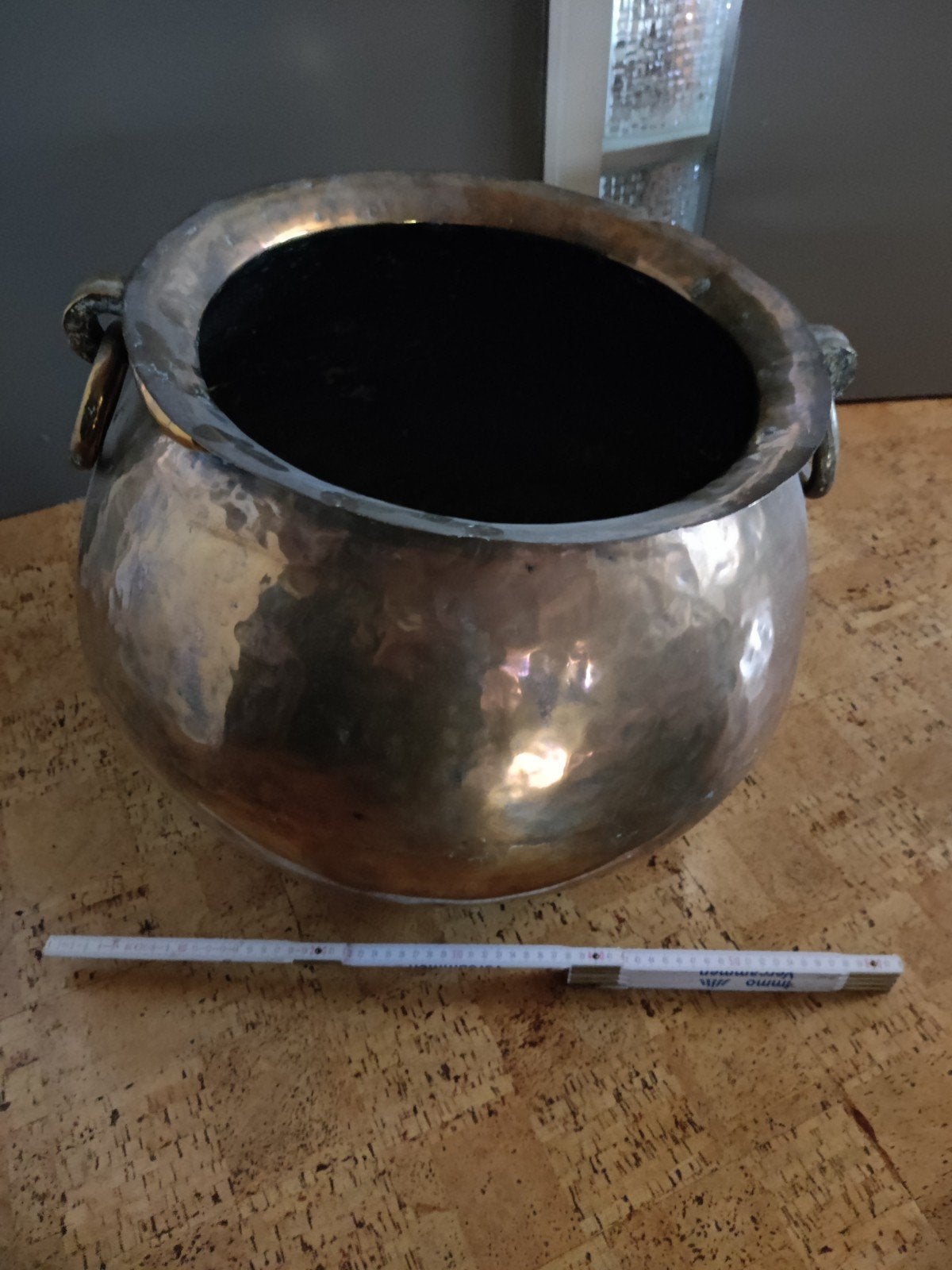 Grote koperen pot, Ophalen