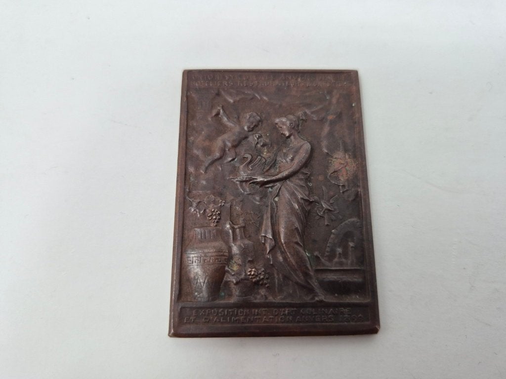 Bronzen kunstplaquette Wereldtentoonstelling – Hoteliers..., Enlèvement, Bronze