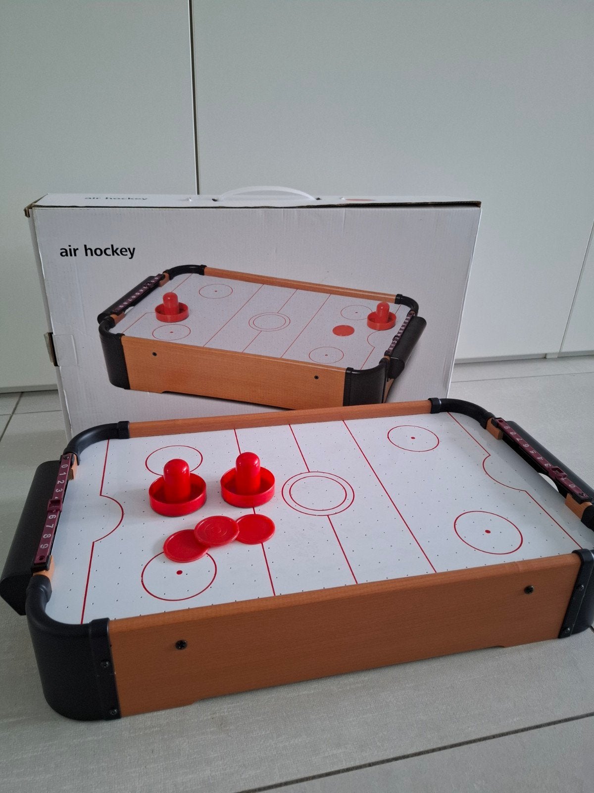 Draagbare mini air hockey tafel, Ophalen
