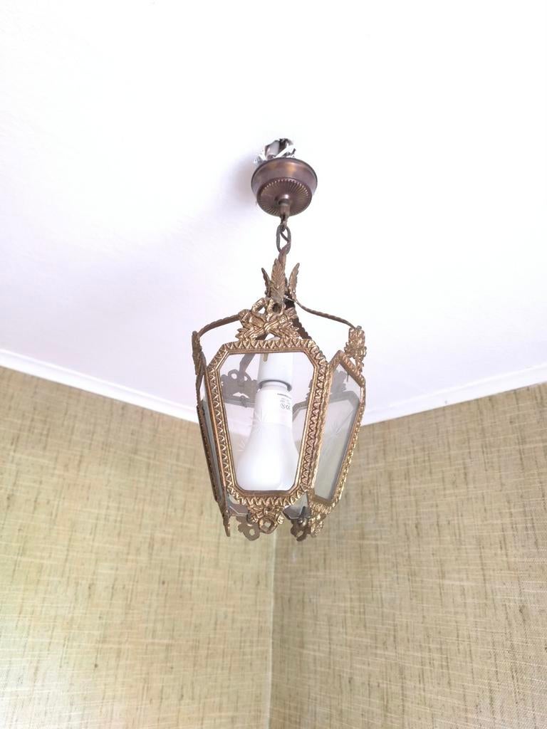 Lustre en  laiton, Ophalen