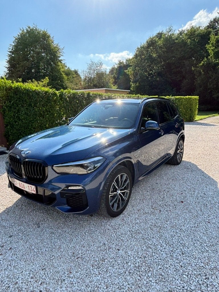 BMW X5 xDrive45e M | Pano | Luchtvering | Trekhaak, Automaat, Dealer onderhouden, Blauw, 5 zetels