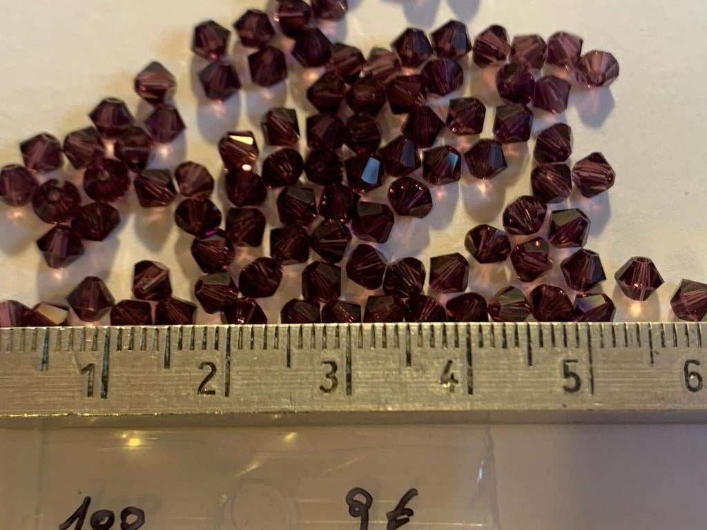 100 Swarovski tolletjes donker amethist, Ophalen of Verzenden, Nieuw, Kraal