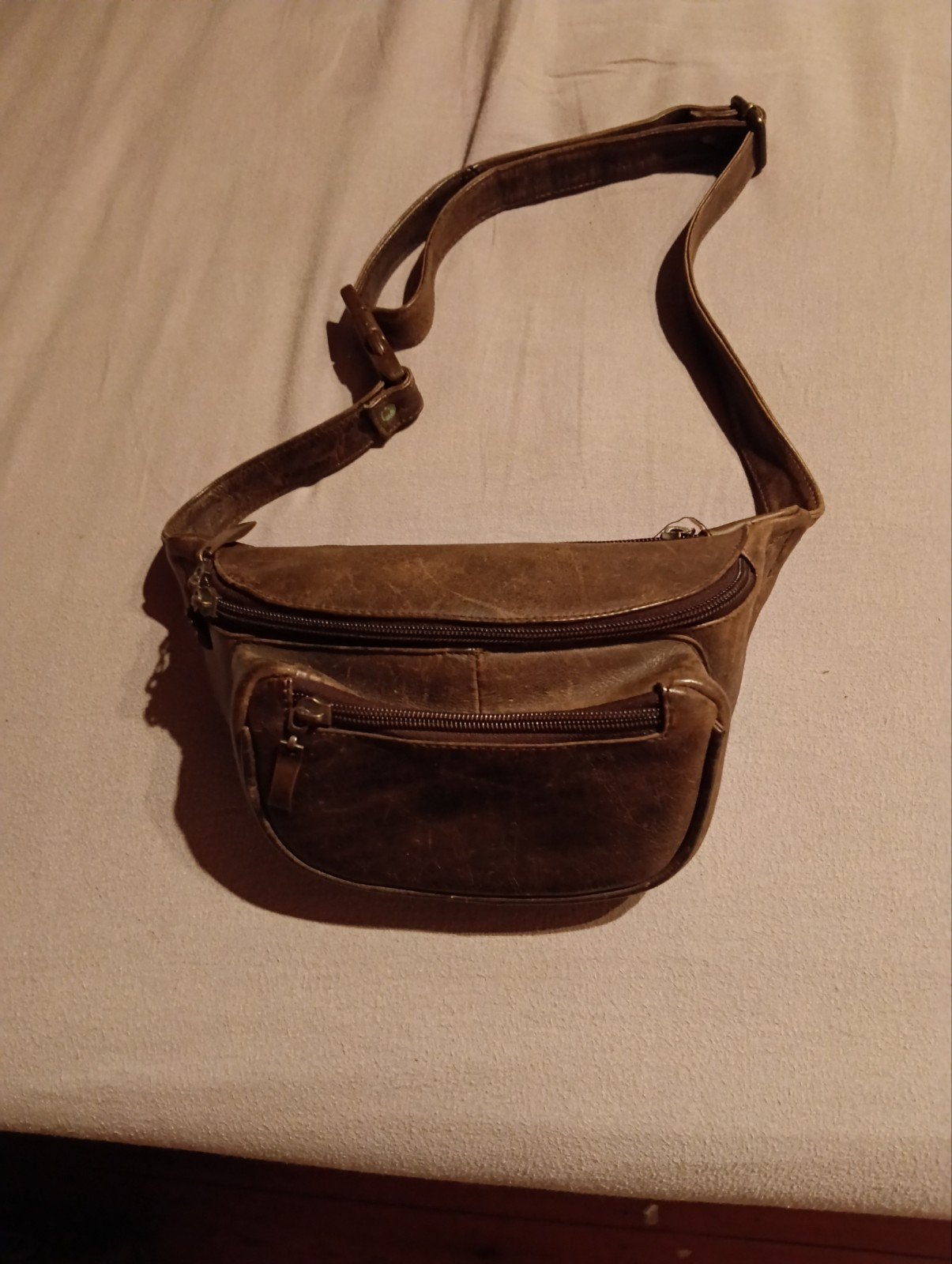 Buidelzakje echt leder, Ophalen