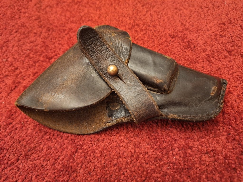 Gladlederen FN 1906 holster, Enlèvement