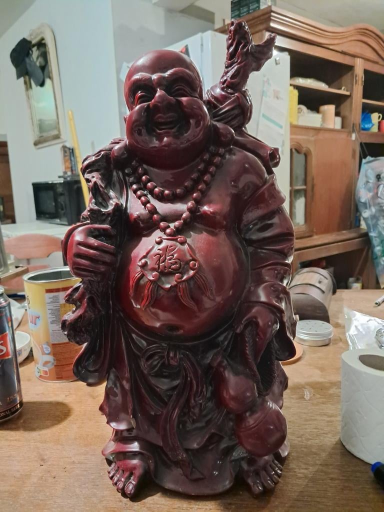 Lachende Boeddha, Ophalen