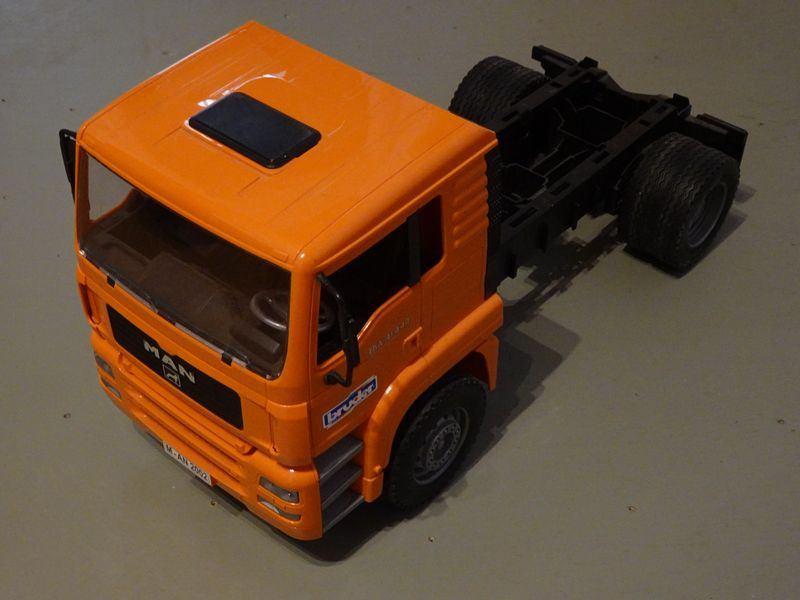 Bruder oranje MAN 4x2 vrachtwagen, Ophalen of Verzenden, Zo goed als nieuw